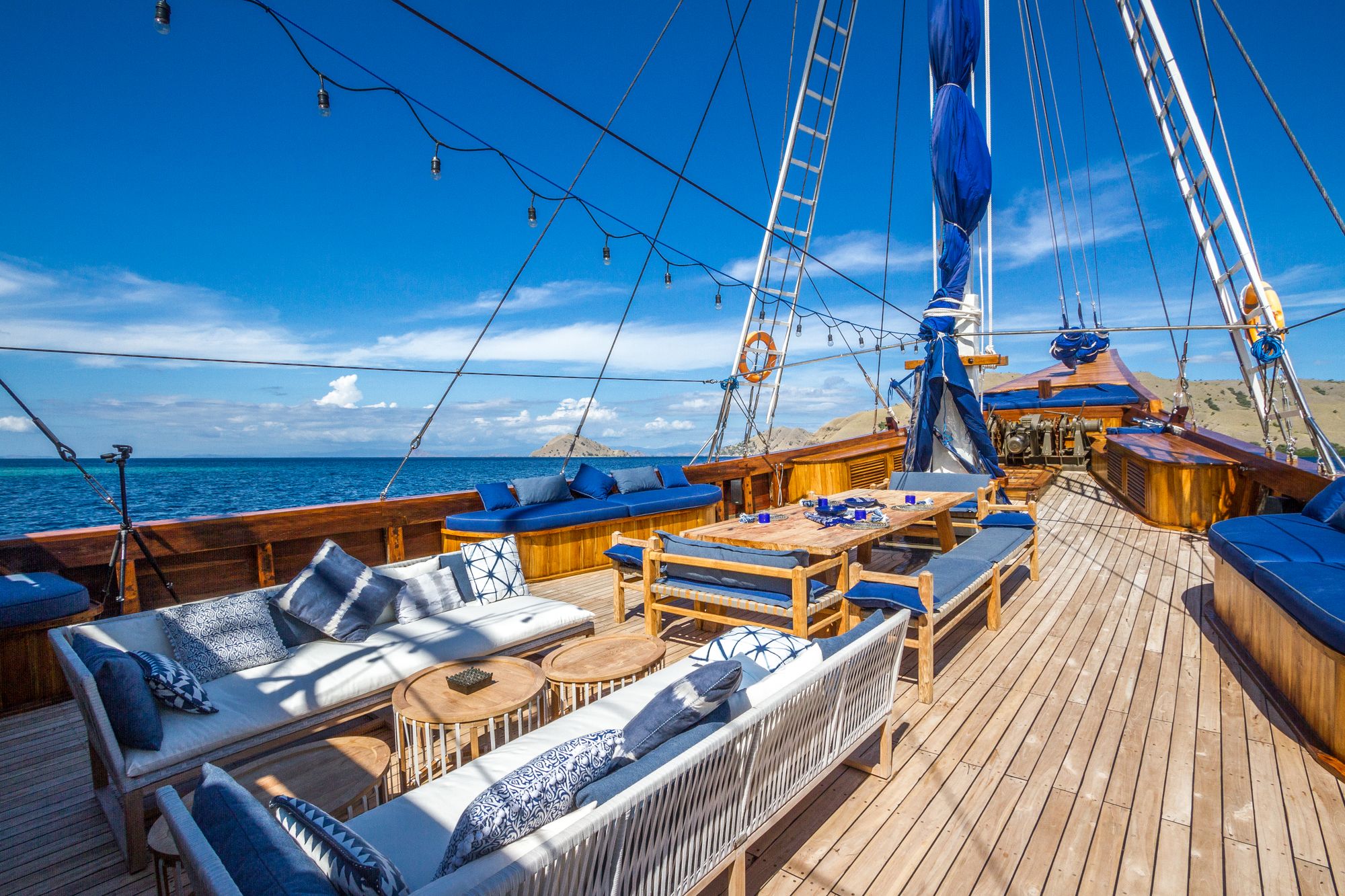 Open teak yacht deck arranged for a private day at sea